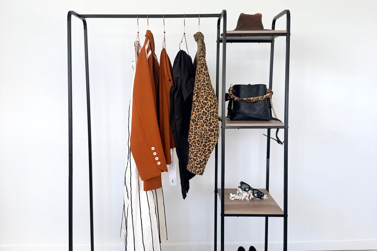 A minimal wardrobe with a small clothing display