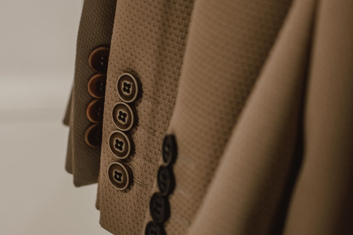 Close-up of hanging blazers