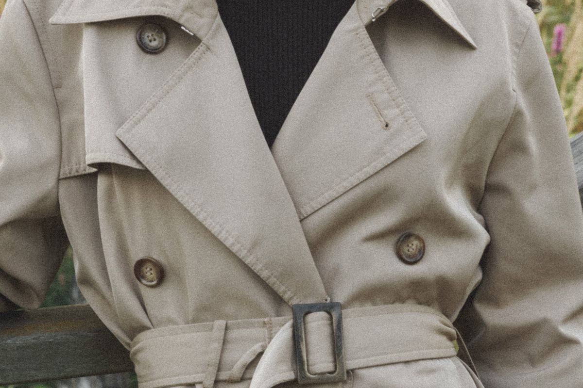 Close-up of a belted trench coat